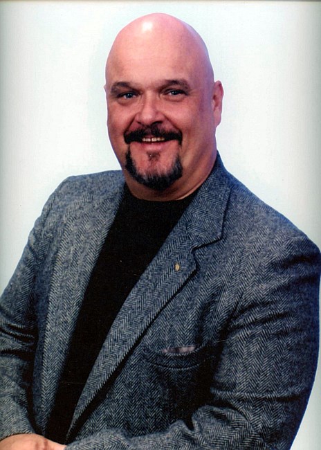 Obituary of Paul Laurence Helzer