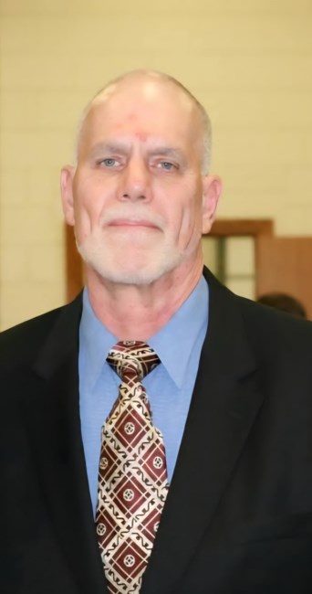 Obituary of James Merle Woolf