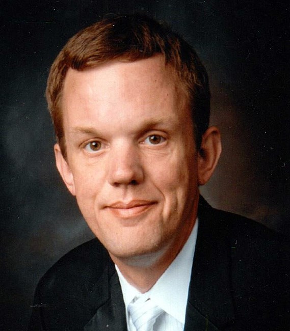 Avis de décès de John C. Abraham